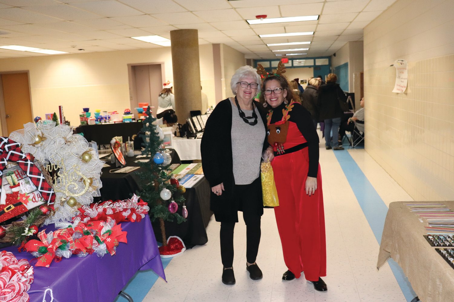 HAPPY HOLIDAYS: Melissa Patrone, one of the many long-time volunteers who has worked tirelessly in presenting past PTSO Holly Fairs at Johnston High School will be decked out in holiday garb and welcoming vendors, shoppers – and Santa Claus - to the 10th annual event on Saturday, Dec. 4.